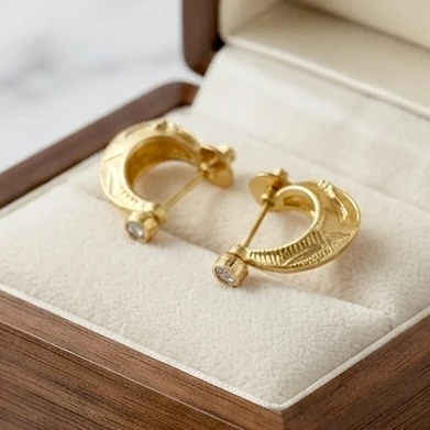 Zivika gold-plated textured hoop earring