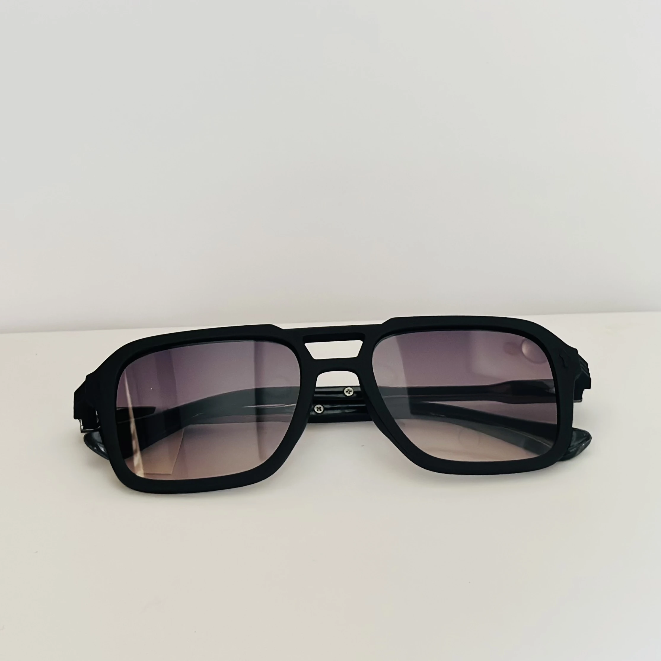 black Carrera 317/S navigator sunglasses with grey gradient lenses.