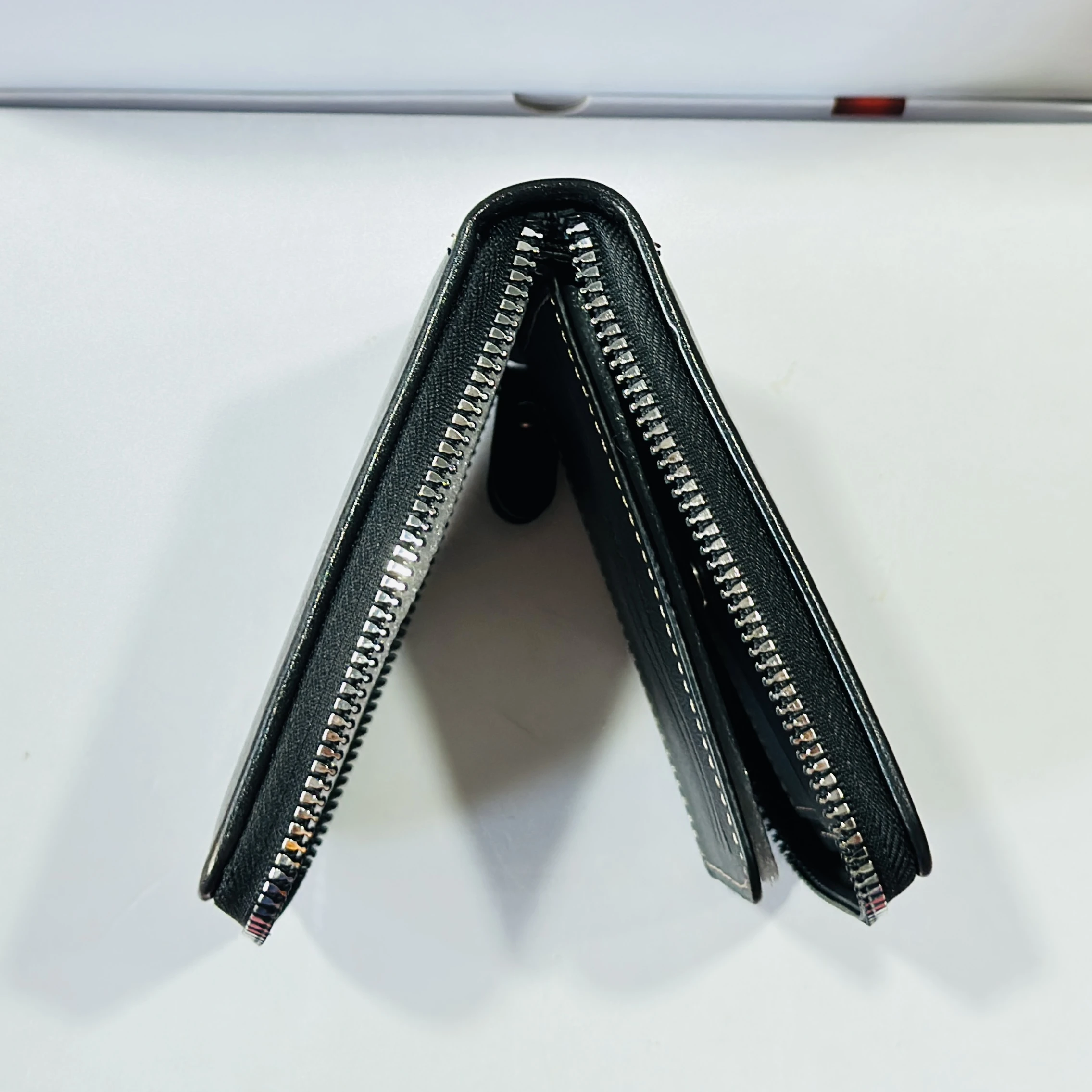 Black bi-fold leather wallet branded "BA LISI".