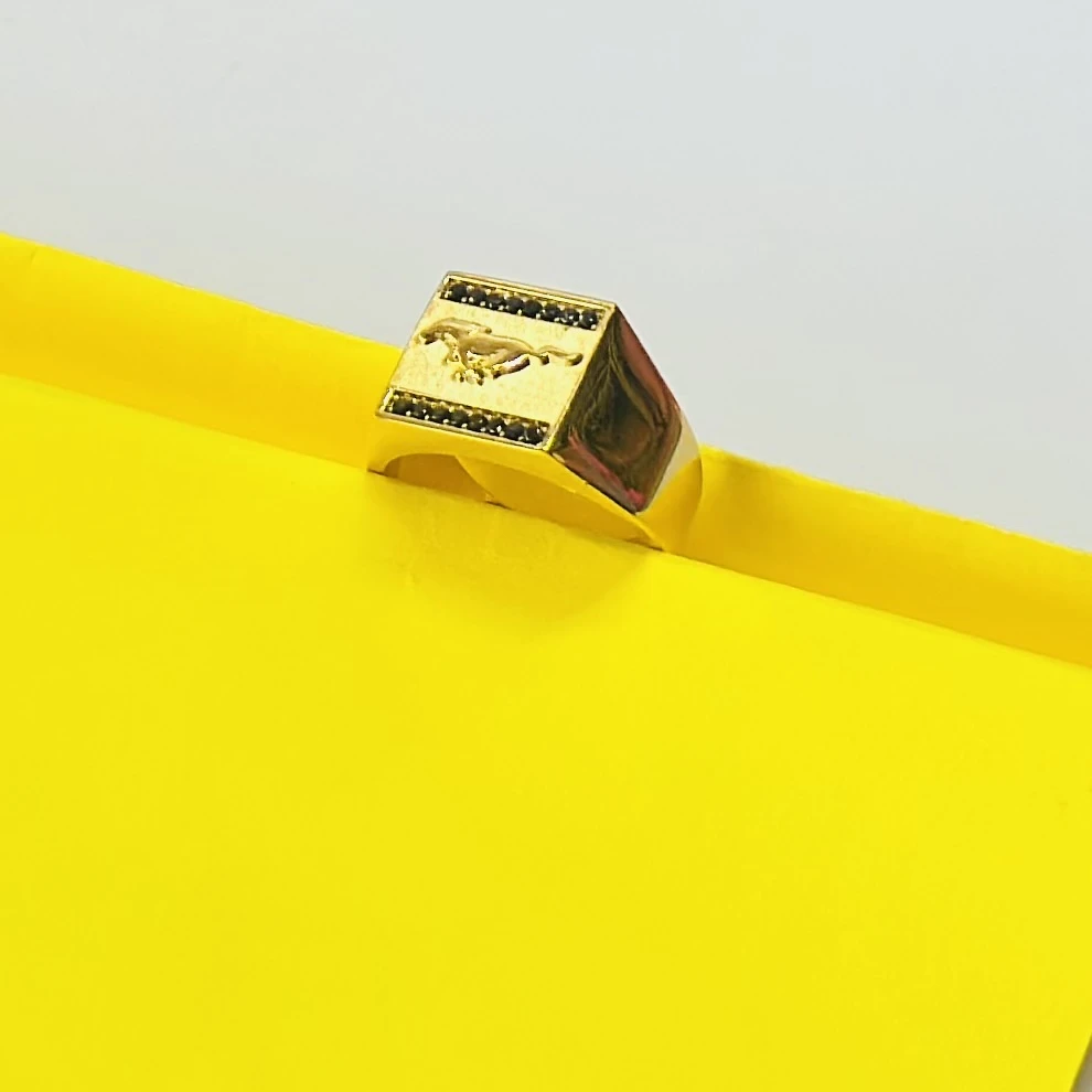 Gold colored Ford Mustang men's ring featuring the running horse logo.