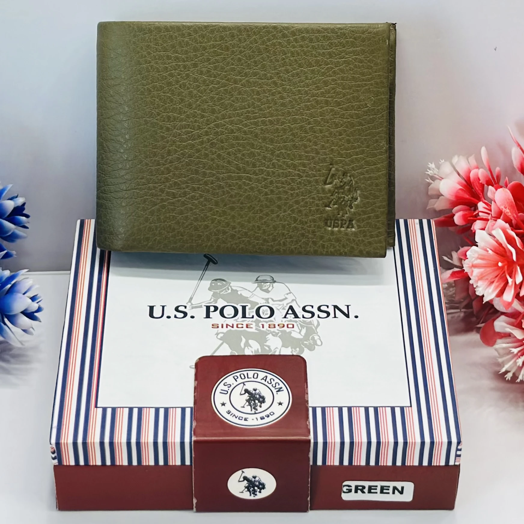 U.S. Polo Assn. men's bi-fold wallet in olive green grained leather.