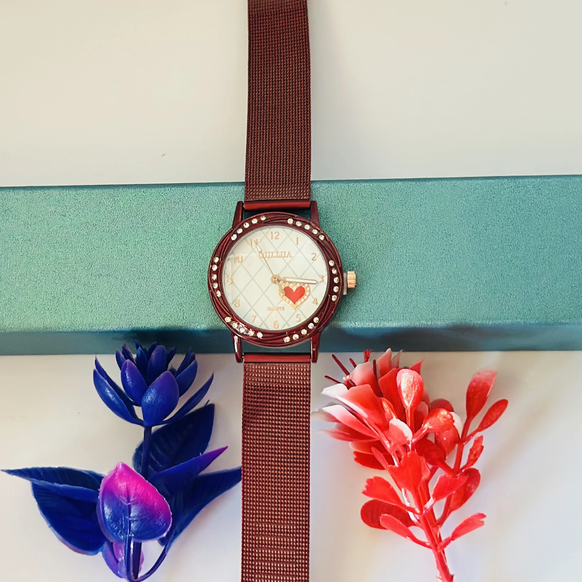 analog watch with a Red magnetic strap