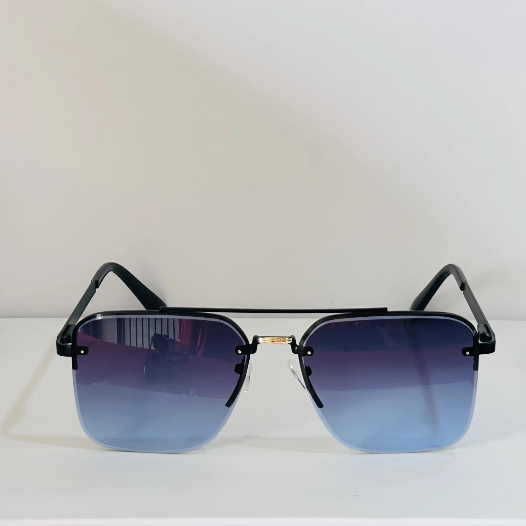 pair of Grey Jack Retro Square or Iron Man Square sunglasses with blue and grey lenses and a black frame.