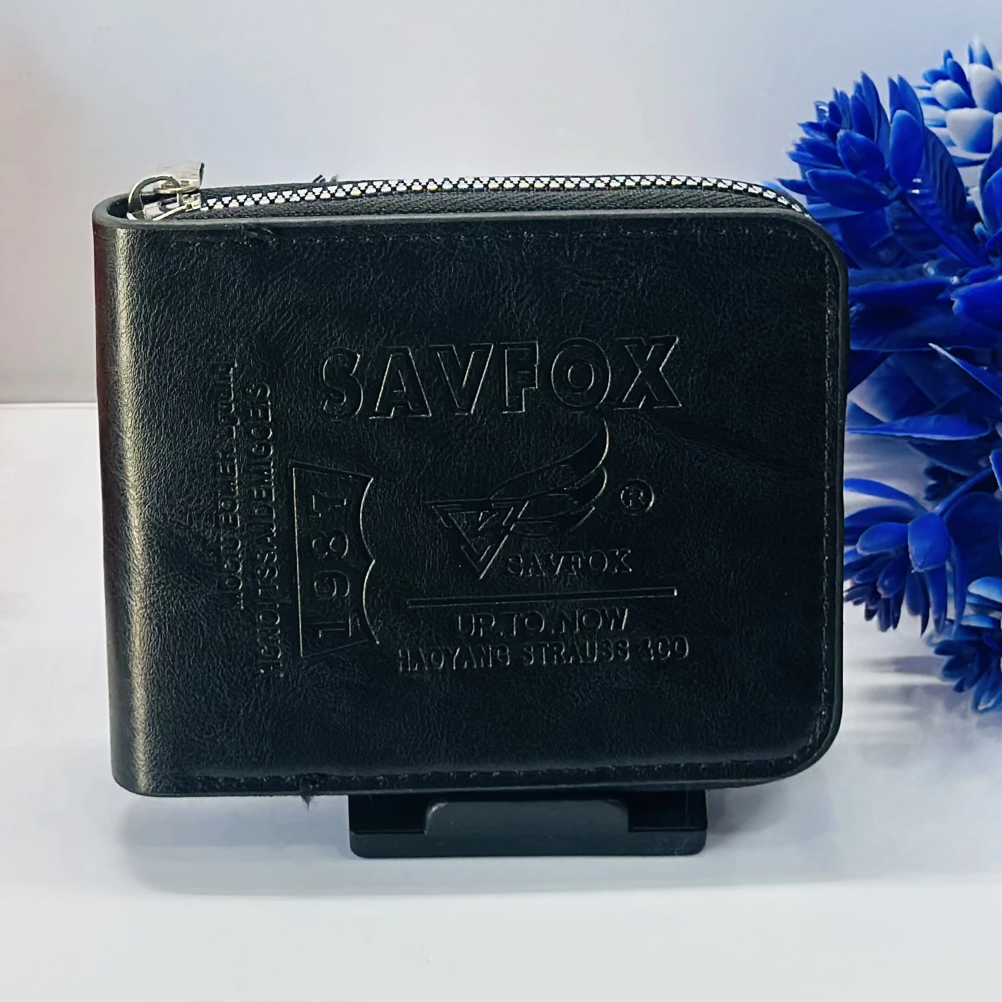 Black faux leather bi-fold wallet by Savfox.