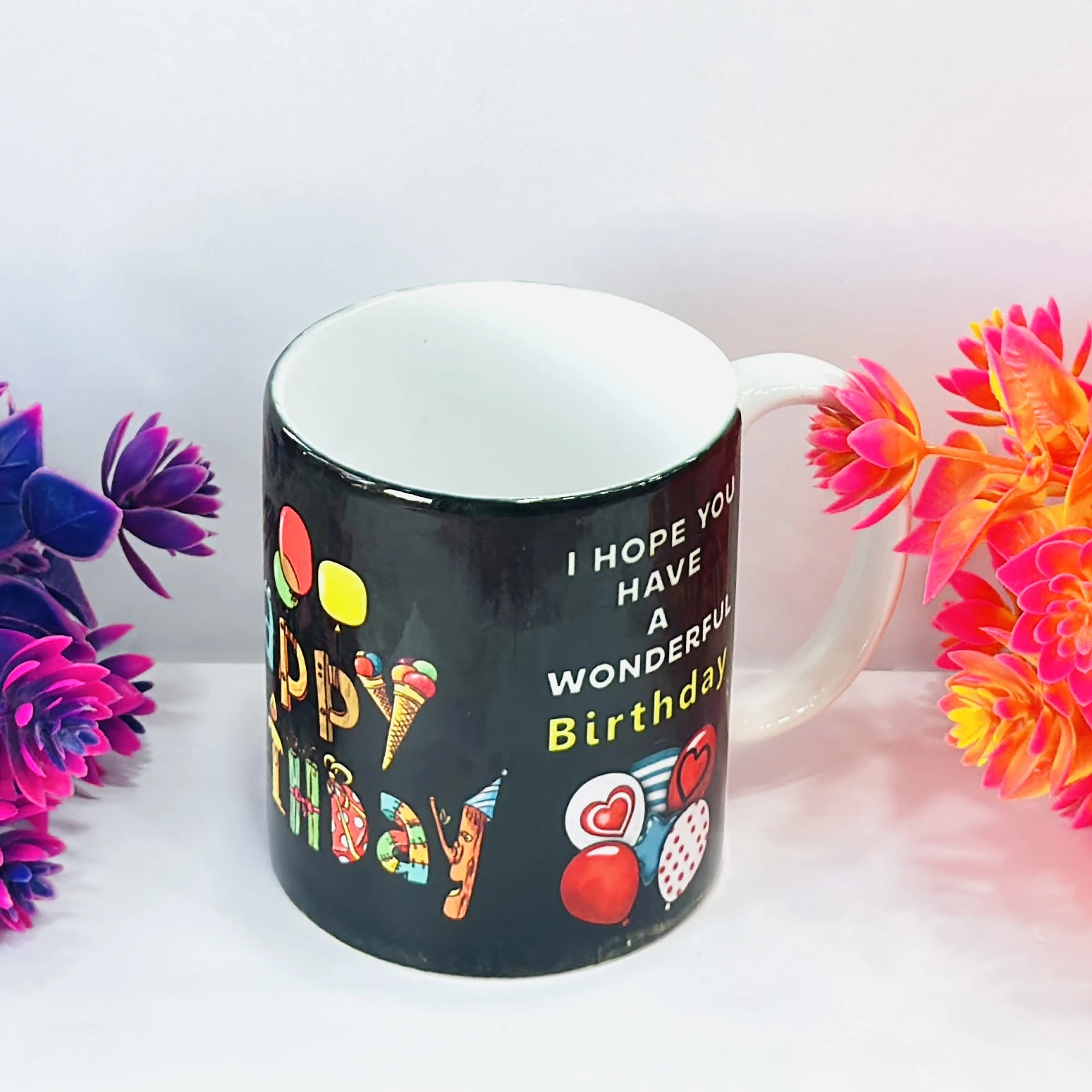 ceramic coffee mug with a "Happy Birthday" print. ….S7EG1P