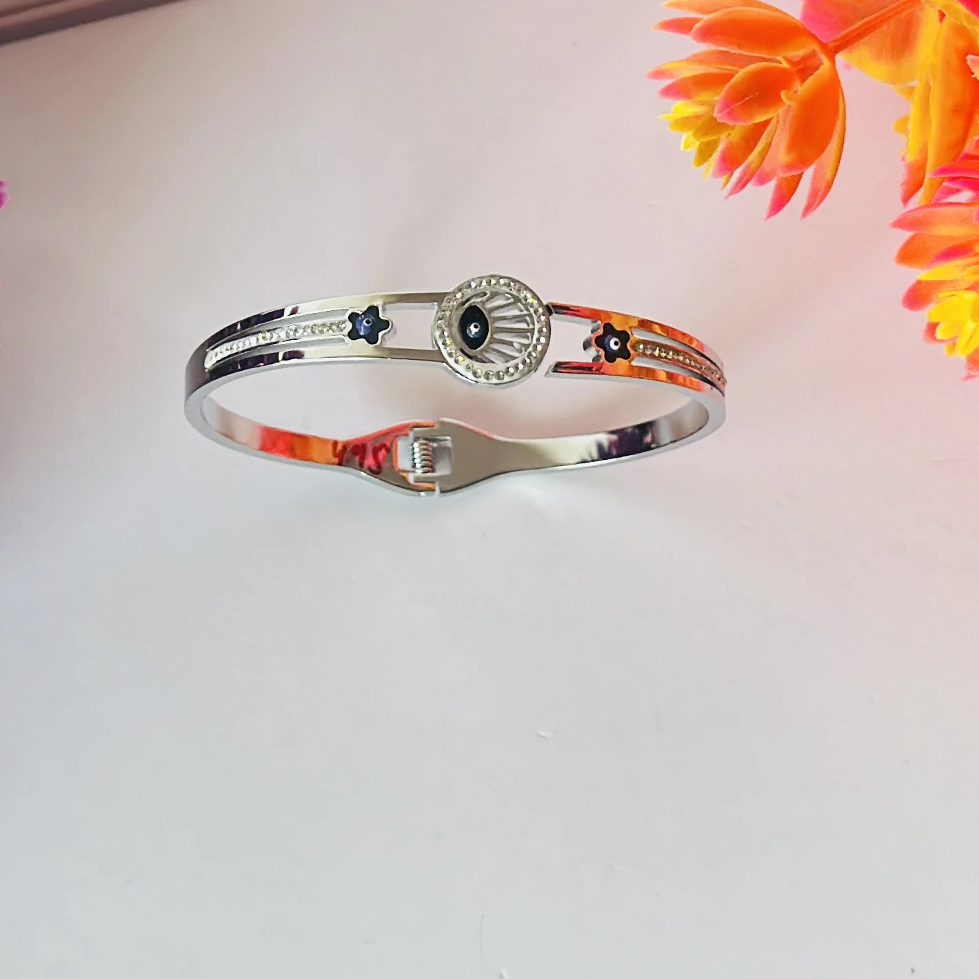 stainless steel silver-plated evil eye bangle bracelet.