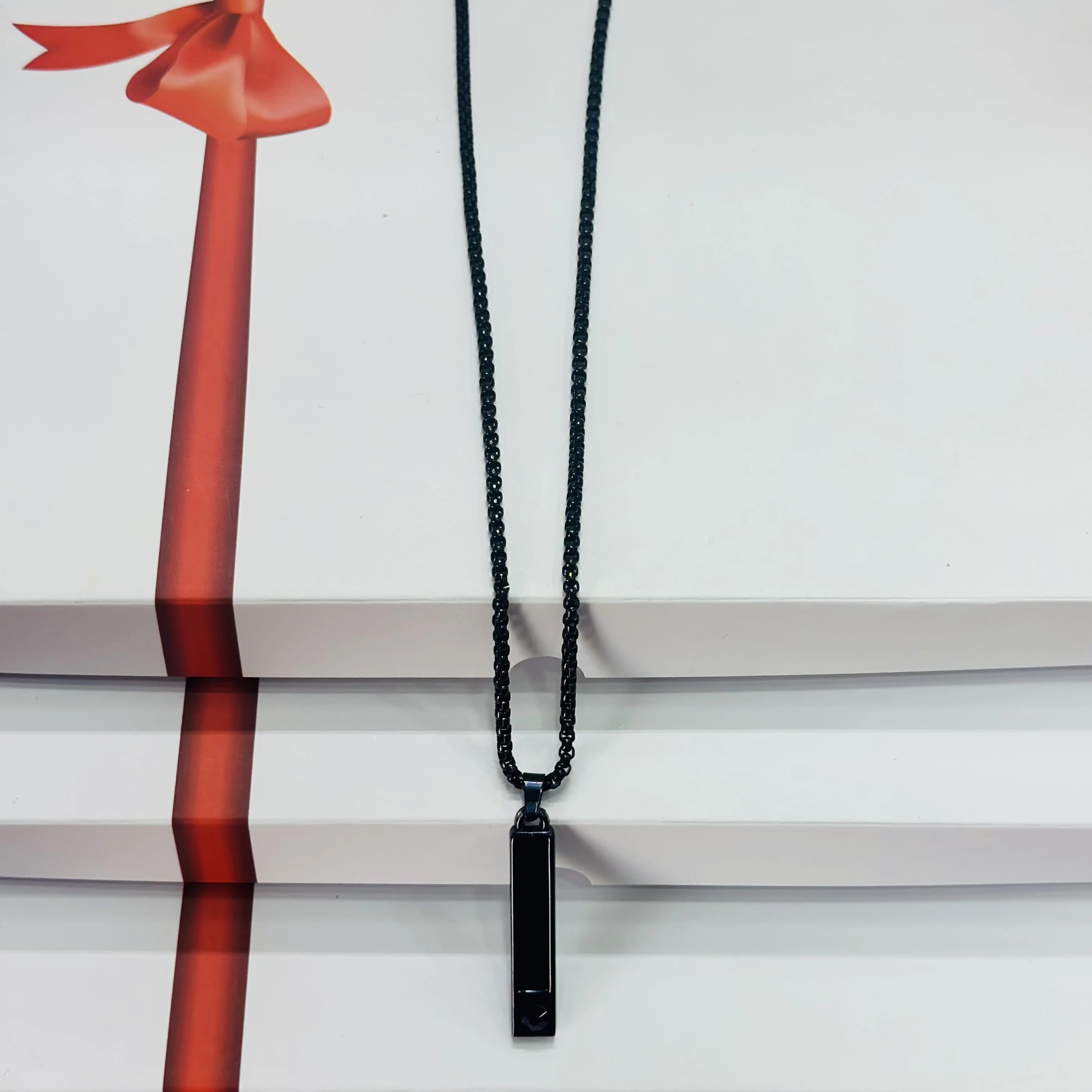 Black stainless steel anxiety relief mindful breathing necklace.