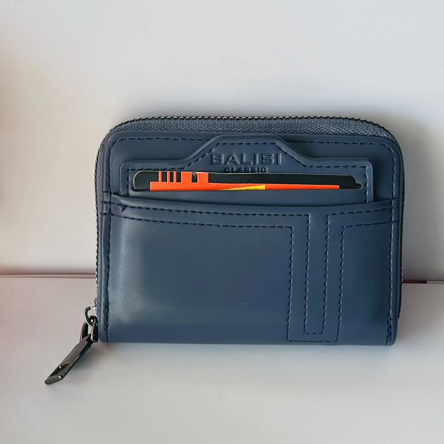 Balisi plain zip button men's wallet in a blue color, likely made of PU leather.