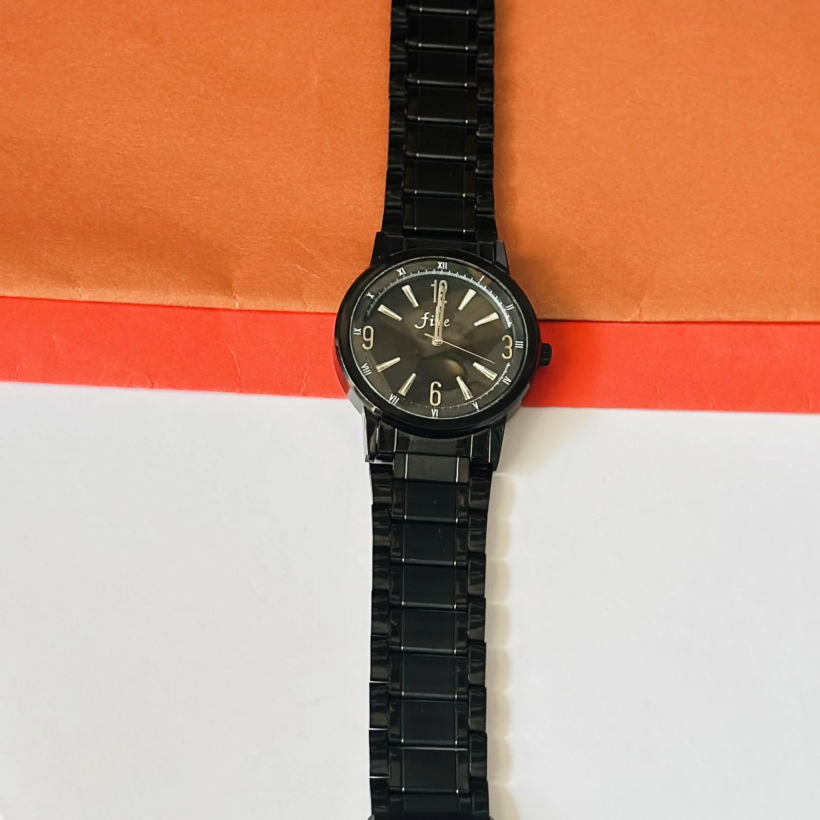Black analog wristwatch