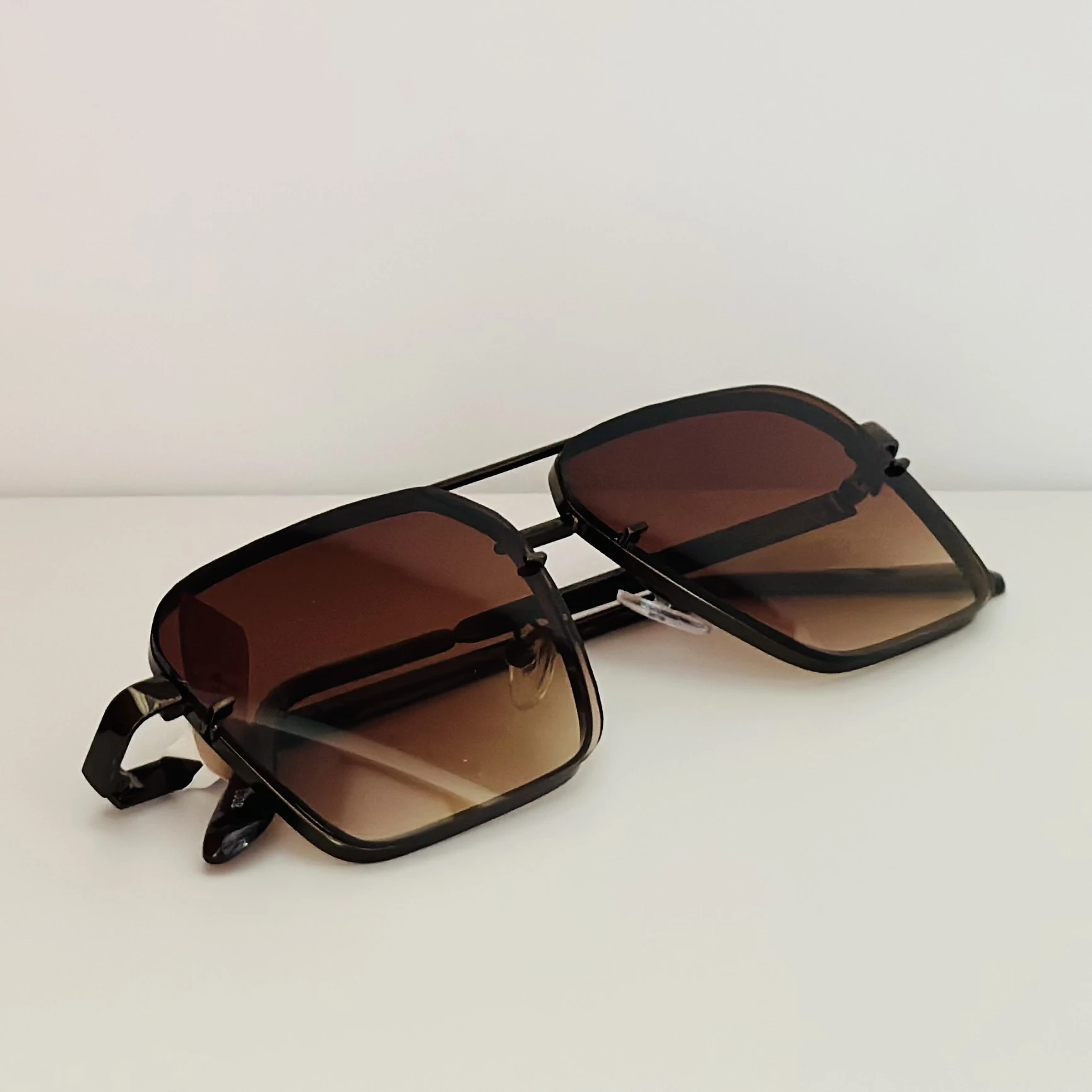 pair of square aviator gradient sunglasses with a brown metal frame.