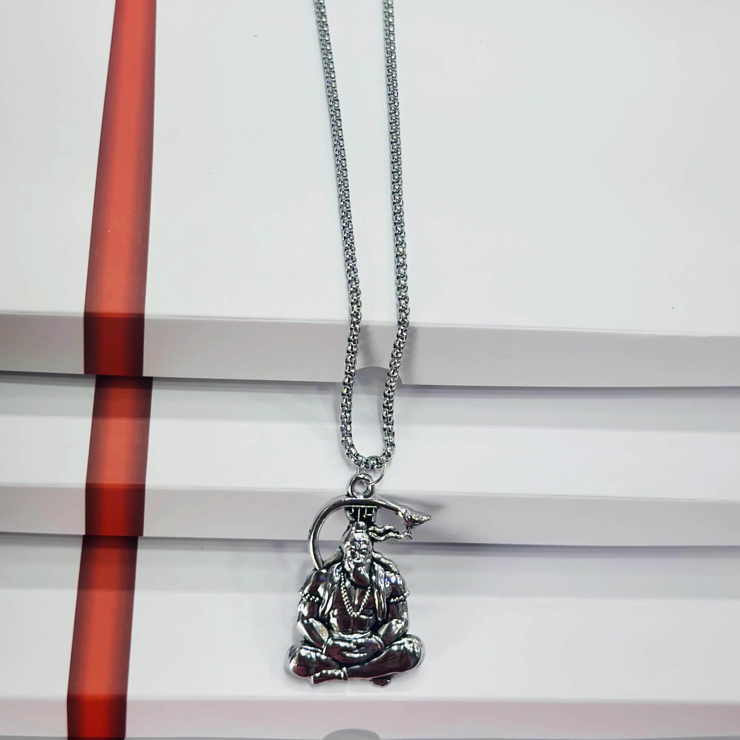 Silver finished Lord Hanuman pendant with a chain.