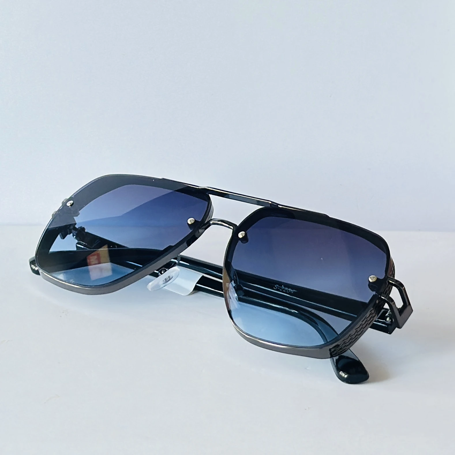 sunglasses appear to be the Maybach