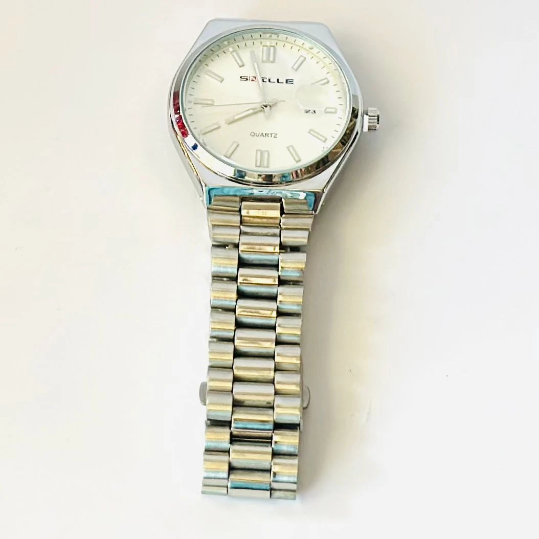 Snille analog quartz watch with a white dial and silver stainless steel strap.