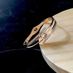 elegant gold-plated crystal-studded cuff bracelet