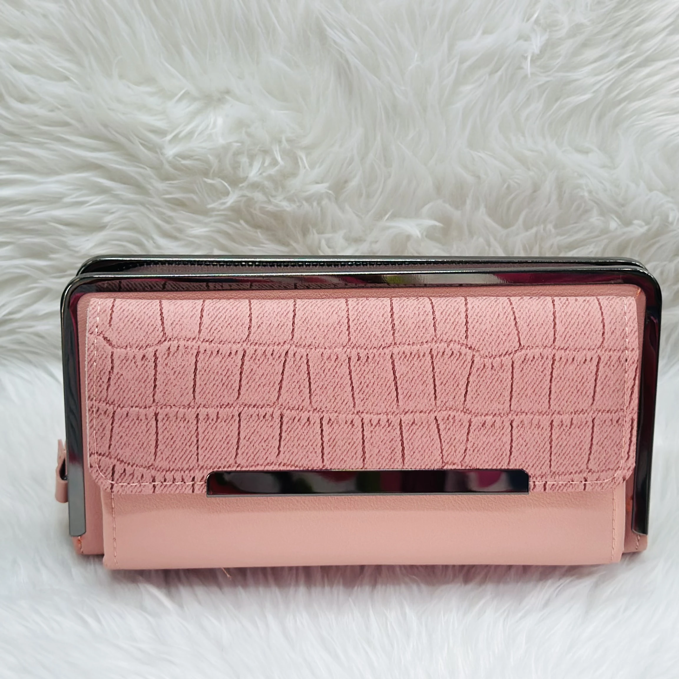 Brisfine pink clutch wallet in polyurethane outer material.