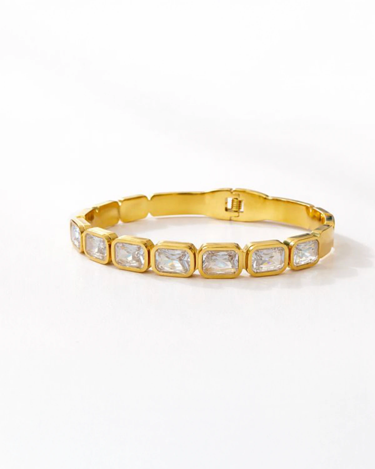 Gold tone hinged bangle bracelet