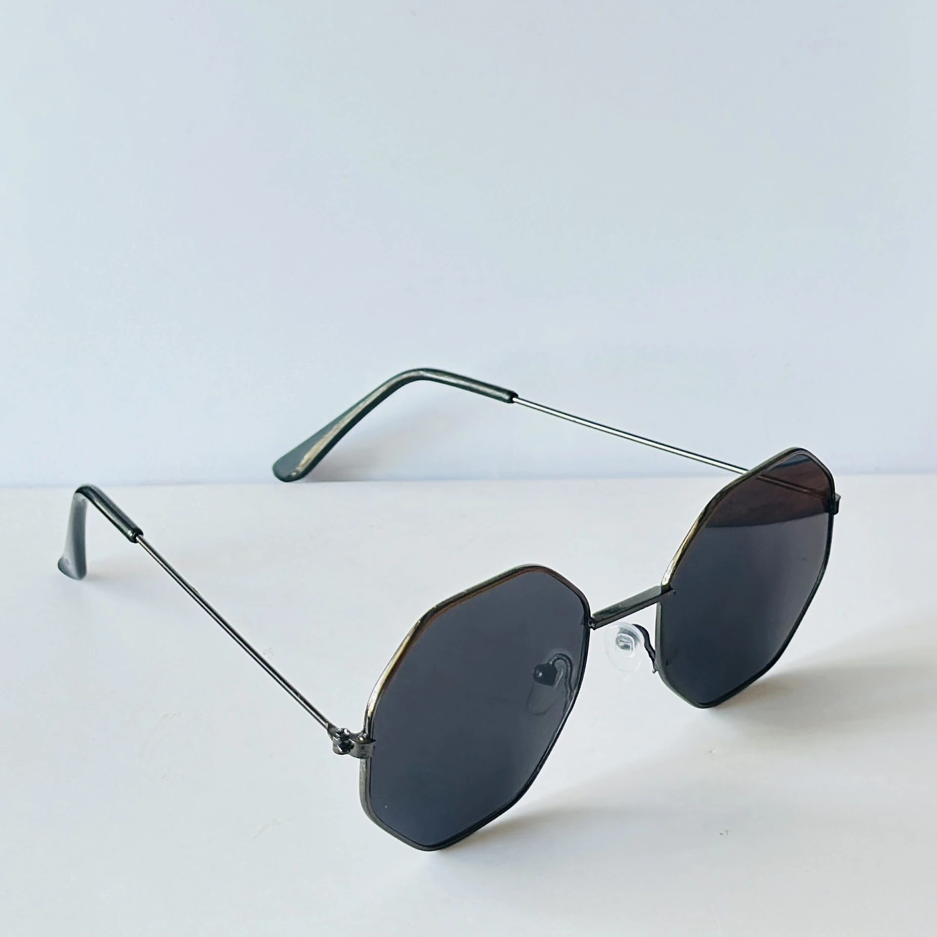 sunglasses appear to be similar to Vincent Chase Octagon Metal Frame Sunglasses