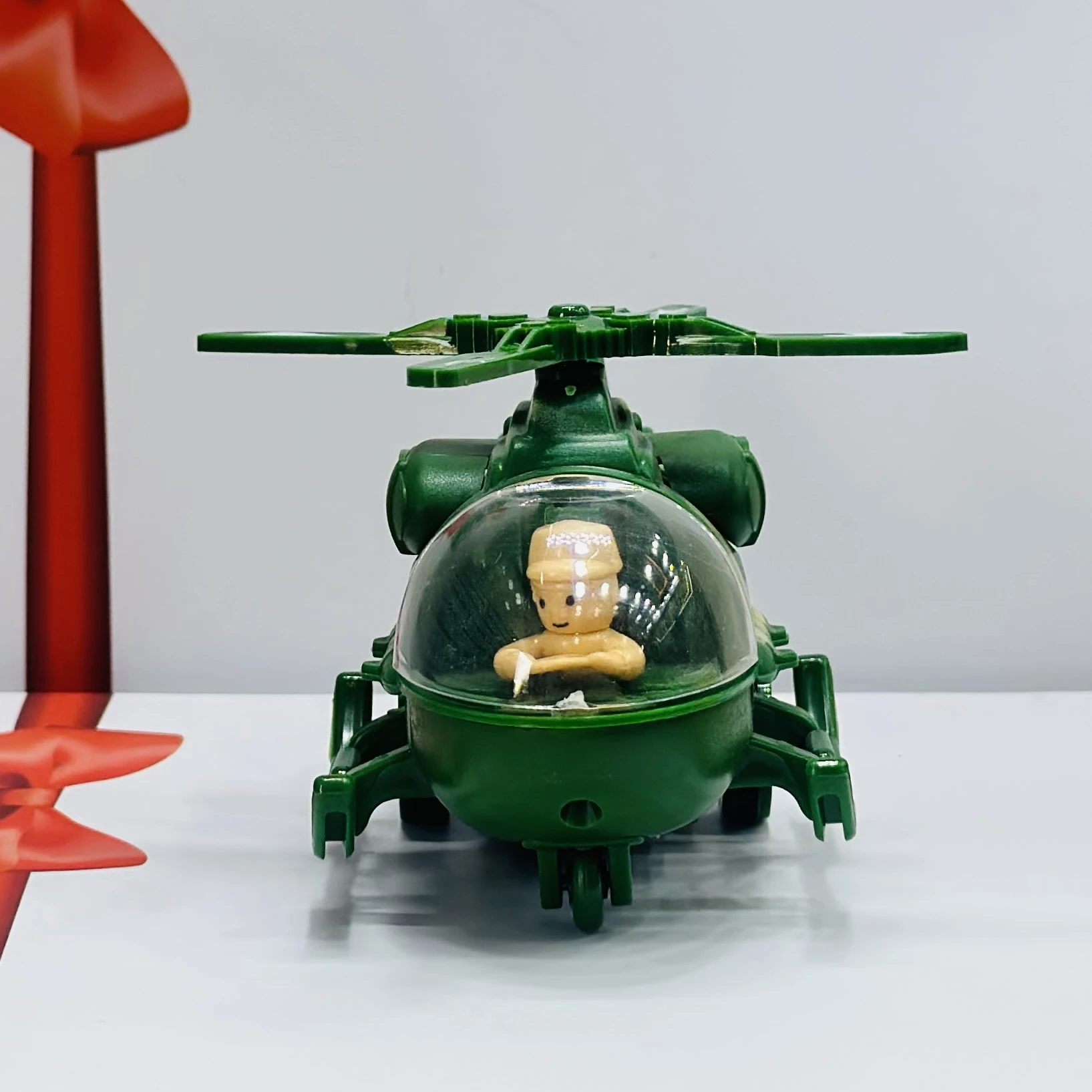 friction-powered toy helicopter