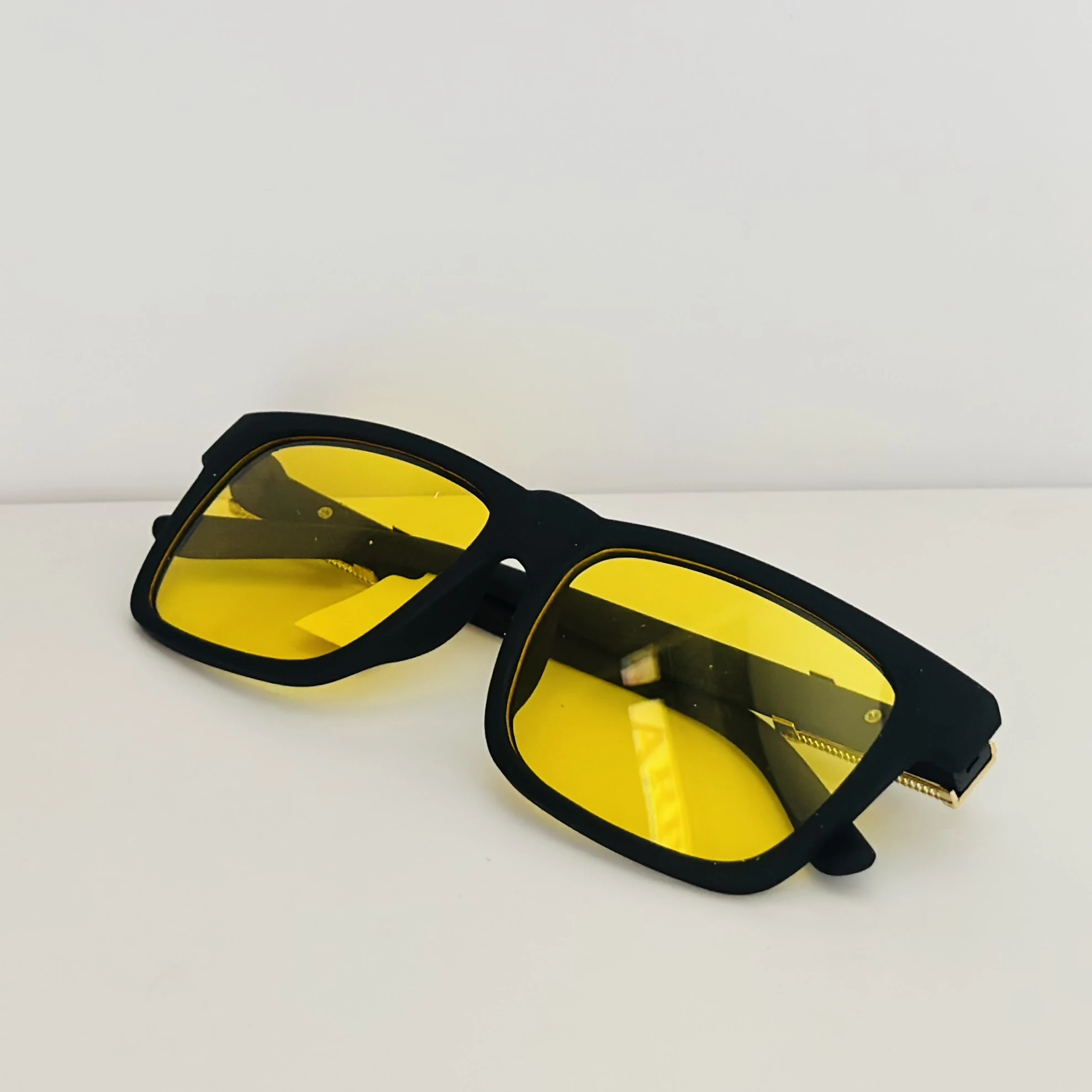 Burberry Knight BE4358 3001/85 square sunglasses in a black acetate frame with yellow lenses.