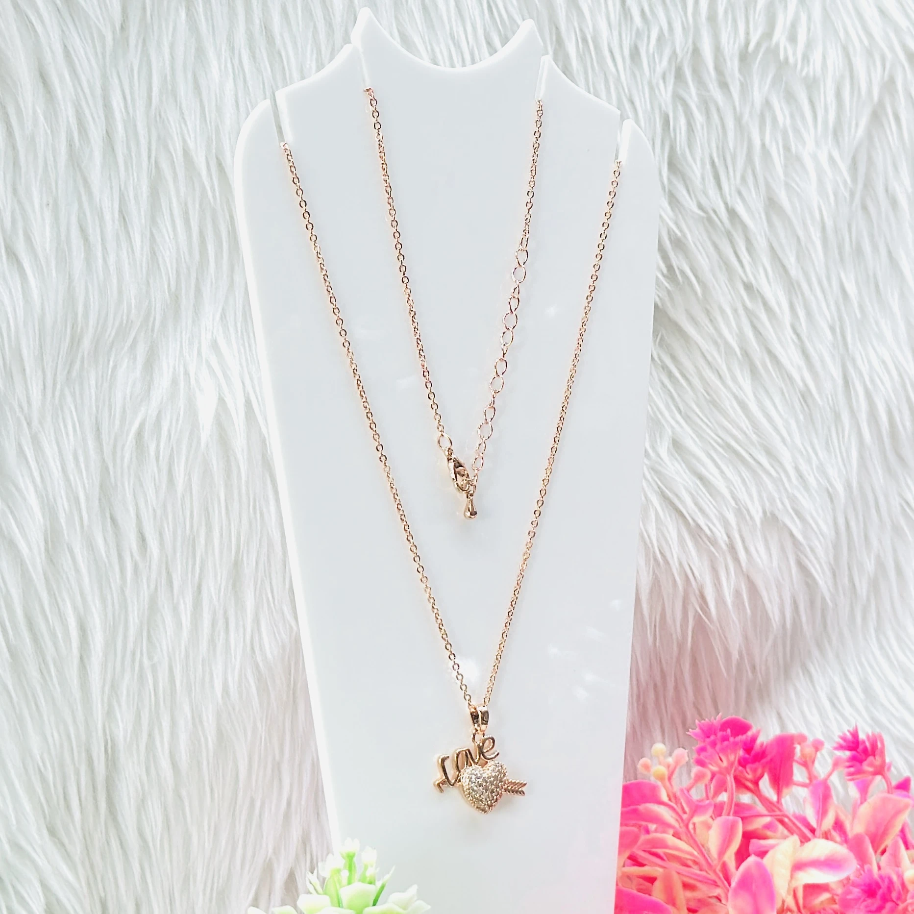 Rose gold necklace set features a heart pendant