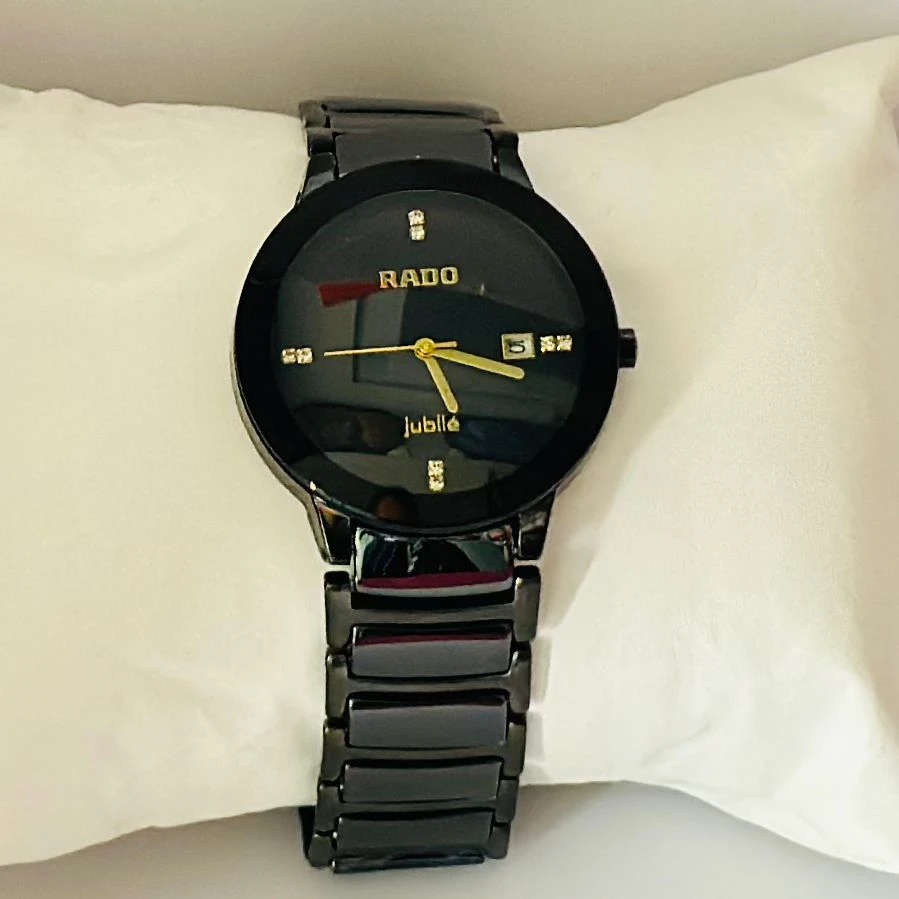 Rado Integral black ceramic and yellow gold-tone watch.