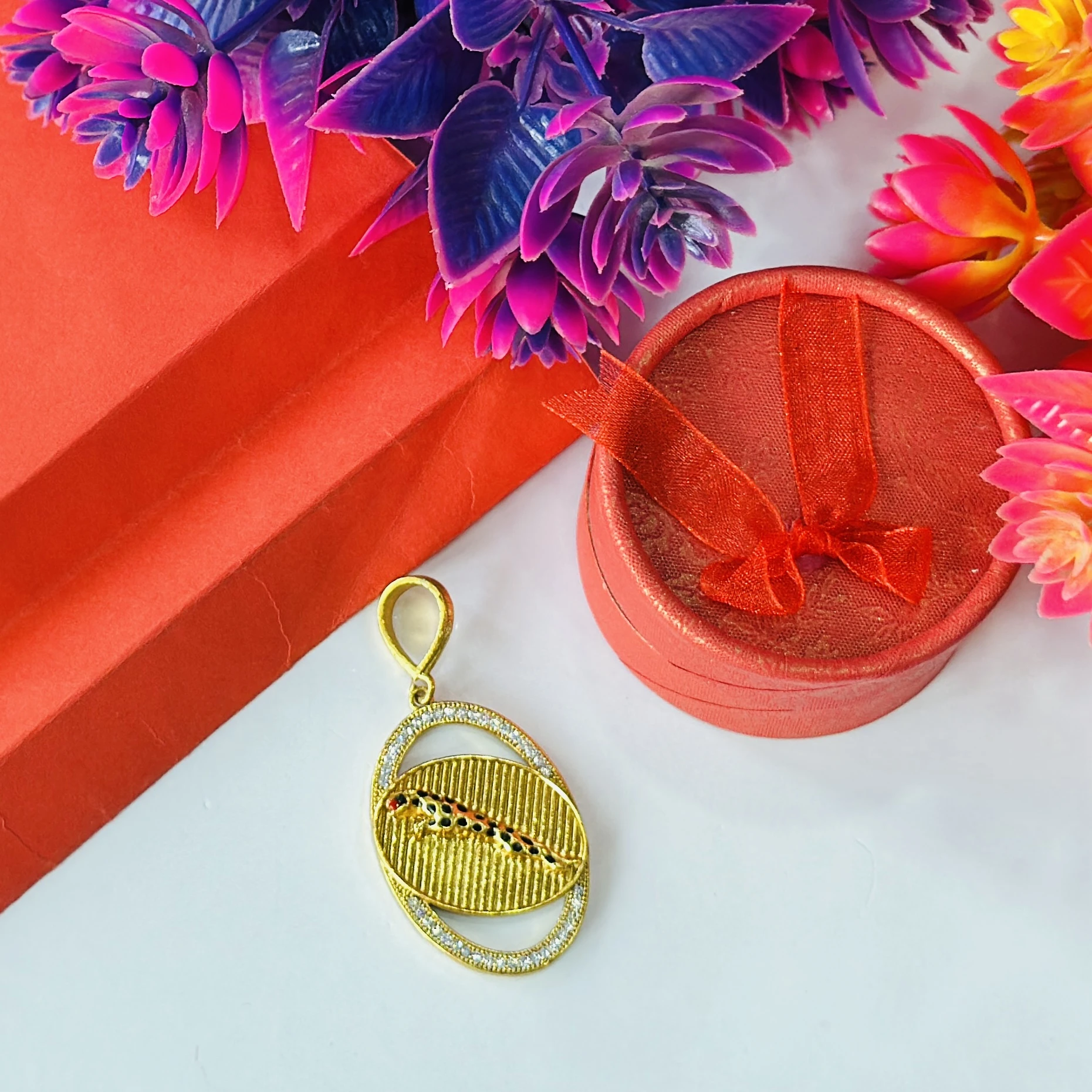 Gold plated pendant featuring a jaguar design.