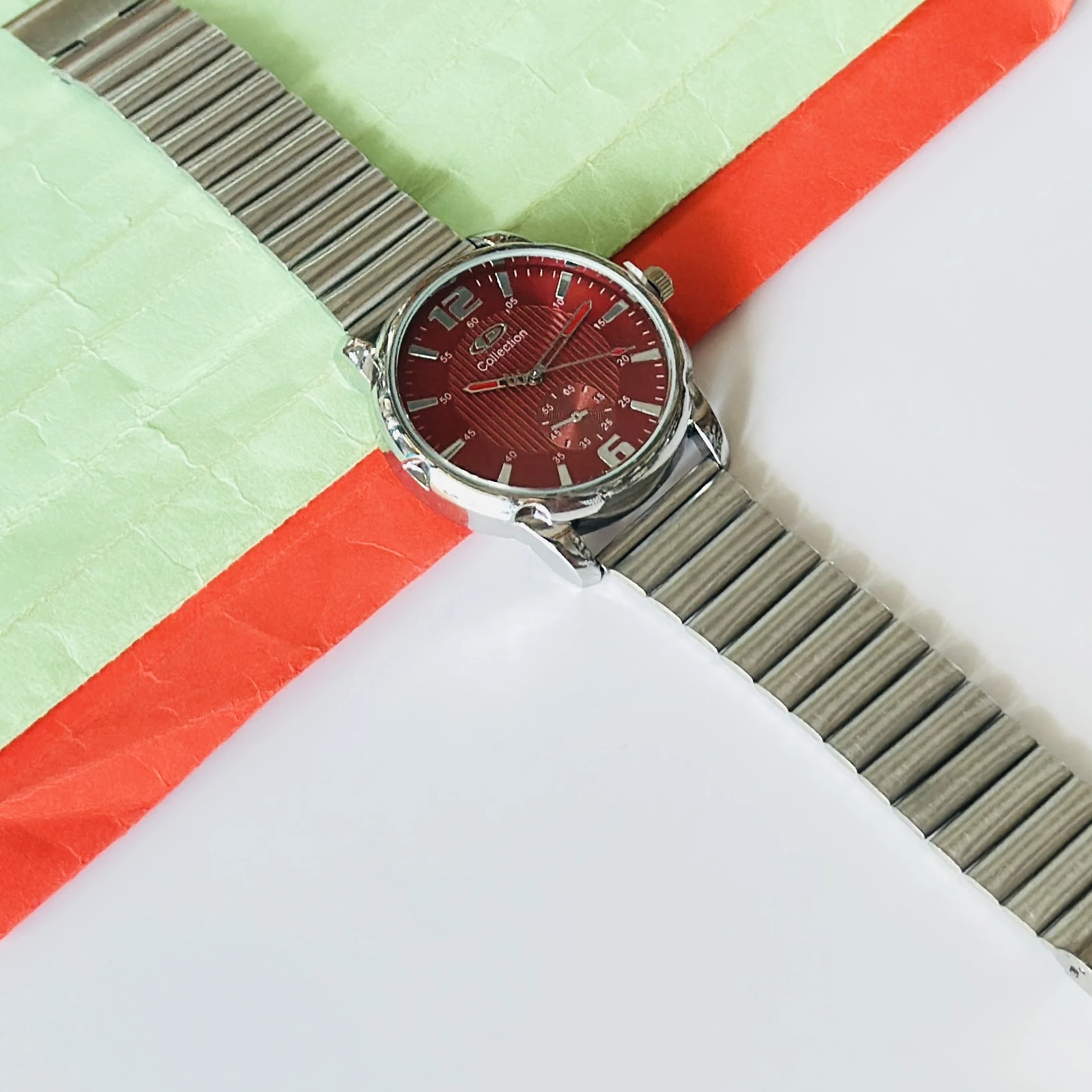 Red dial analog watch