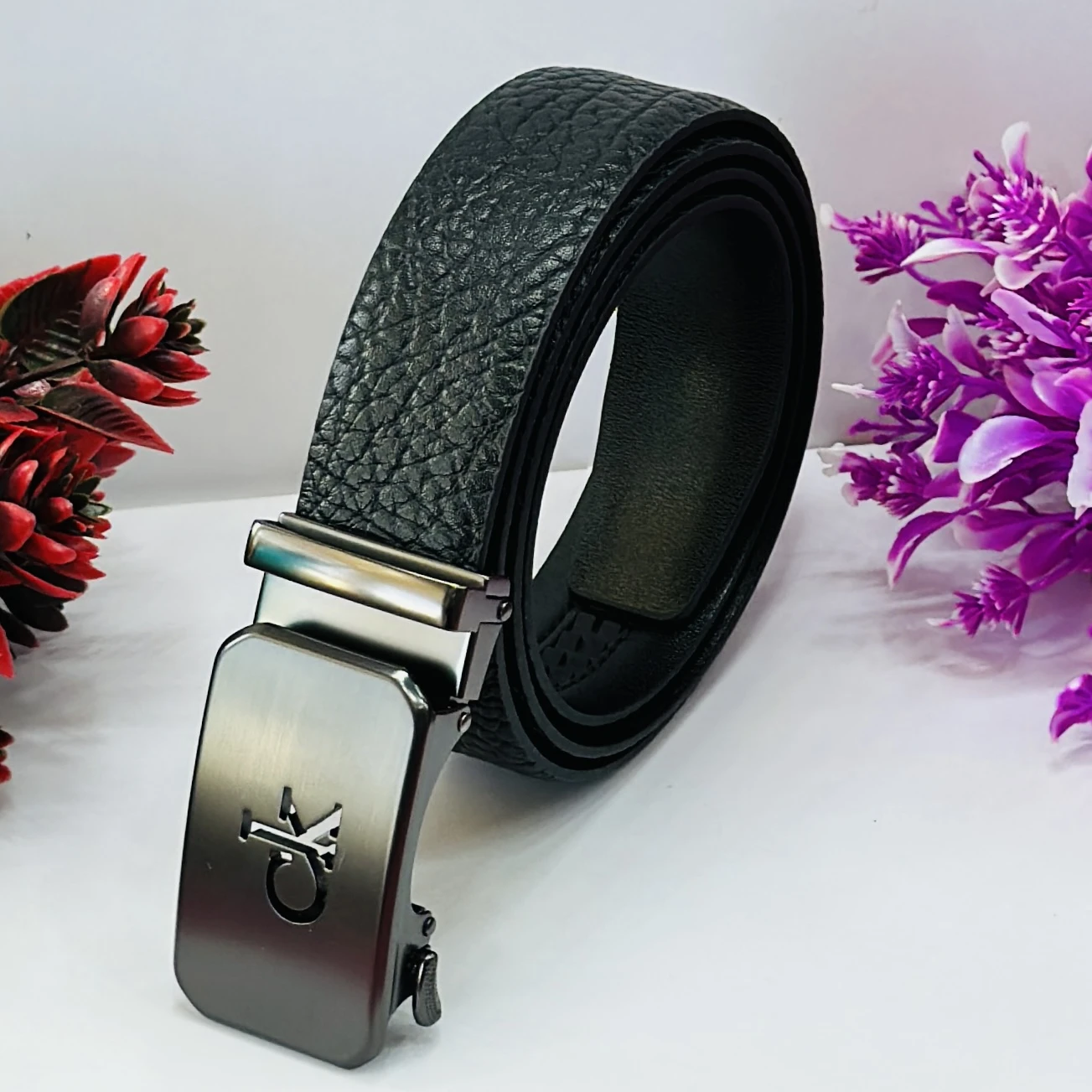 Calvin Klein black genuine leather men's belt with an automatic buckle.