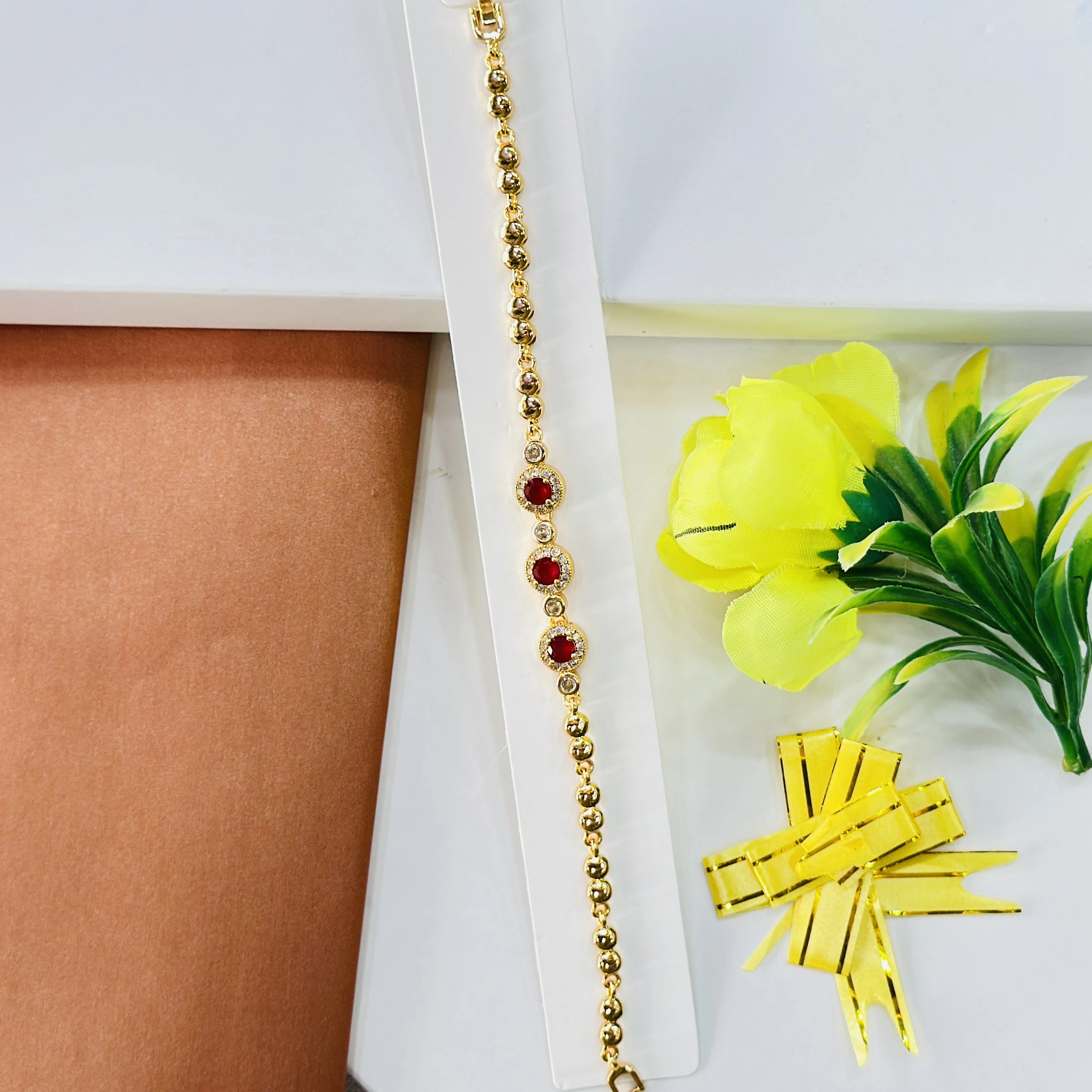 gold-plated bracelet decorated with red stones