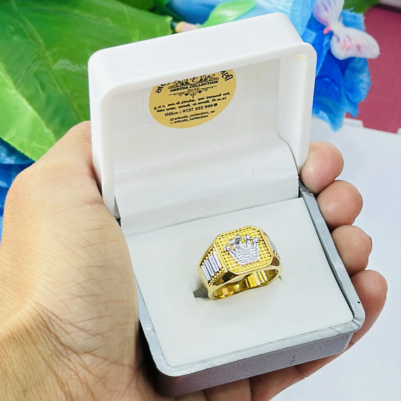 Gold toned men's crown ring