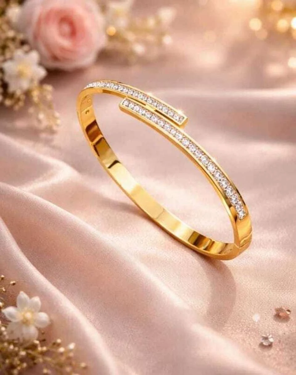 elegant gold-plated crystal-studded cuff bracelet