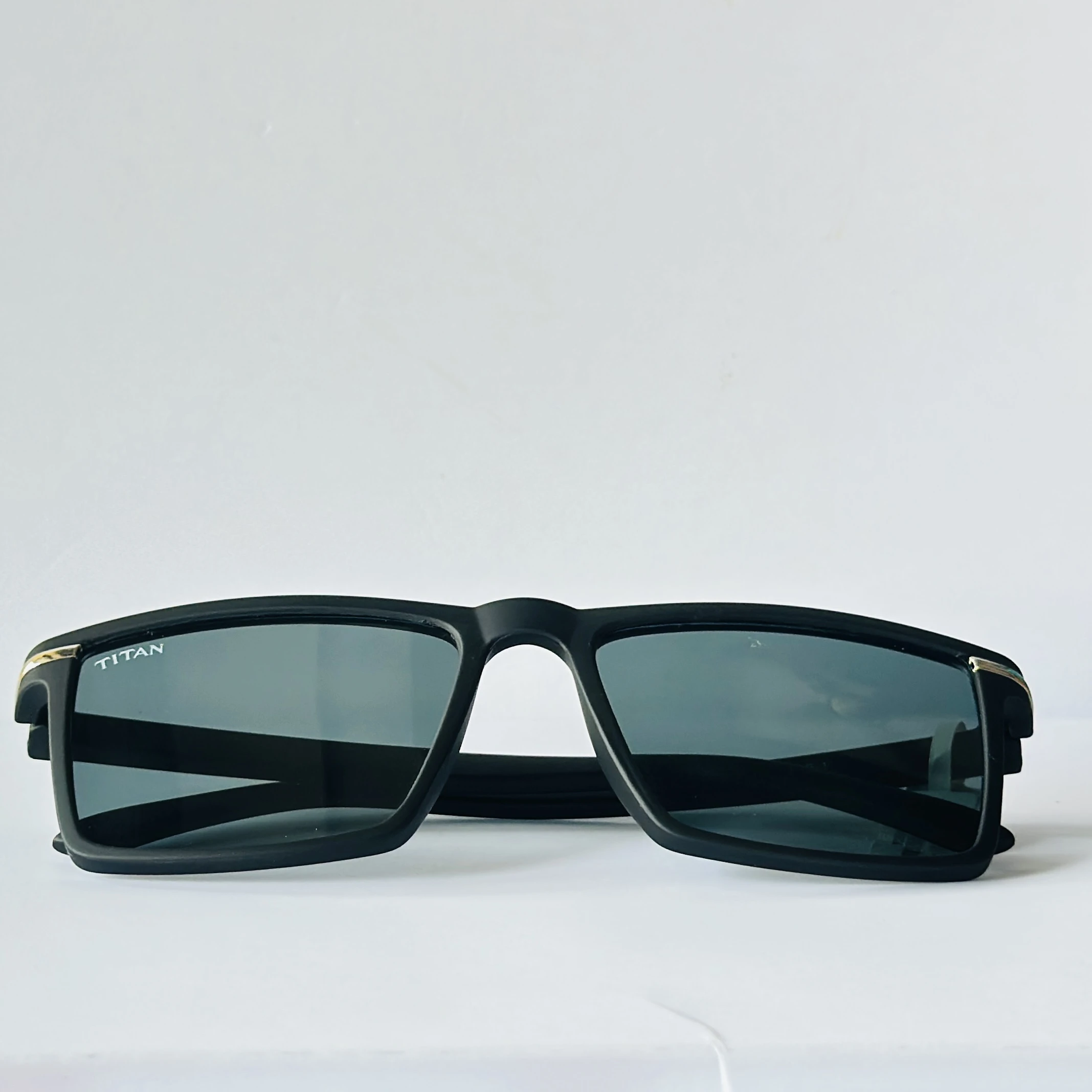 Black rectangular frame with blue-toned lenses.