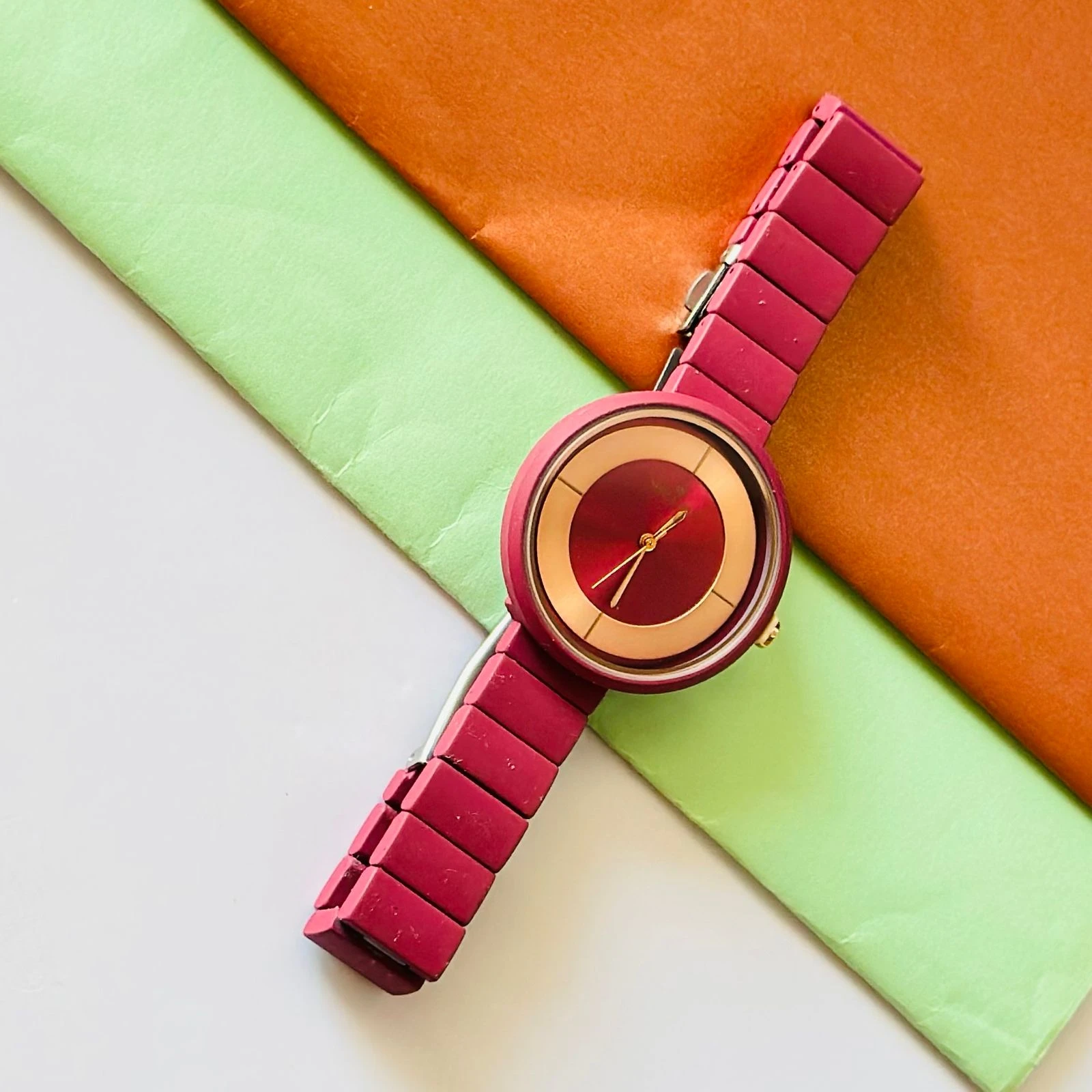burgundy or red analogue watch for women, possibly from brands like Fastrack or Watchstar