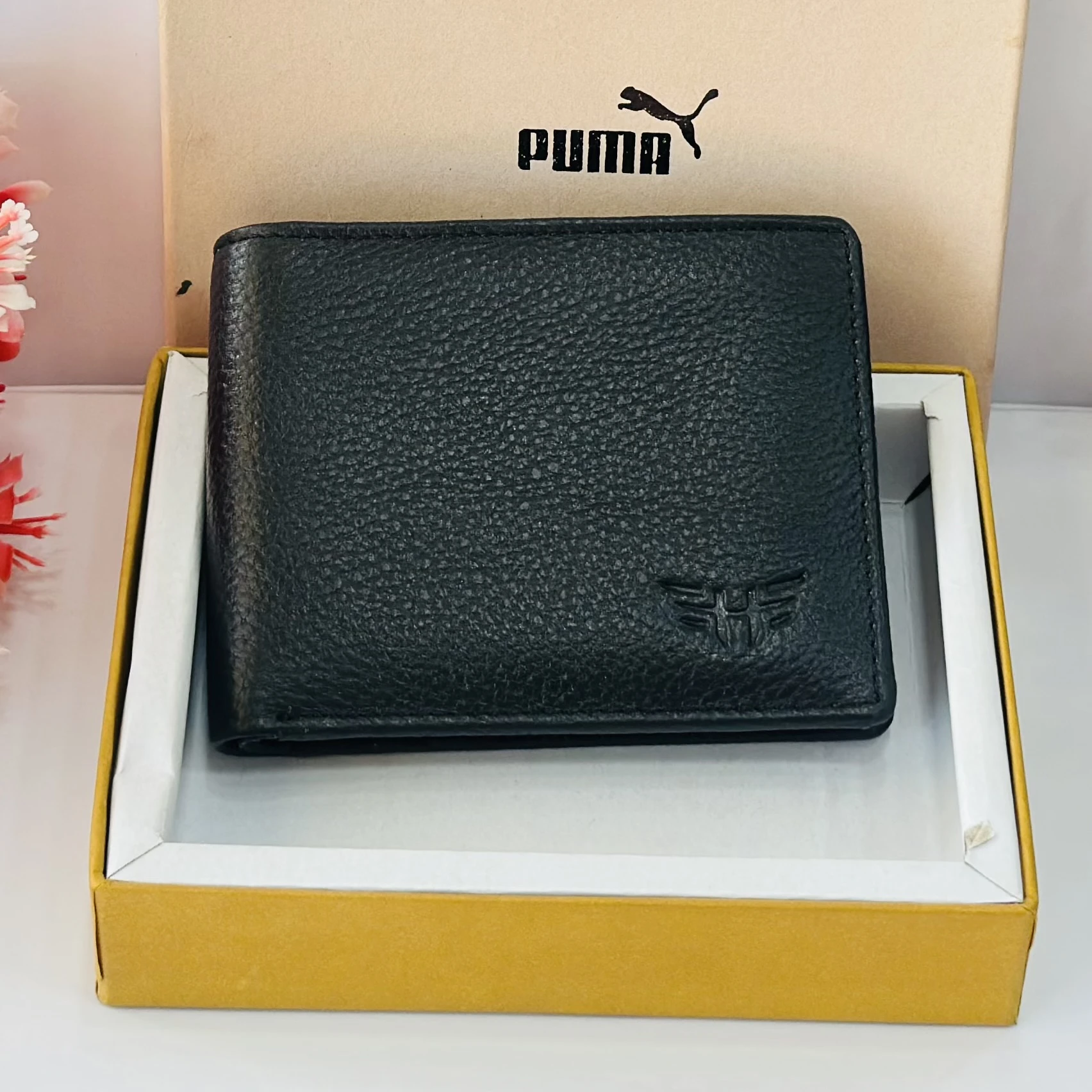 PUMA men's bi-fold leather wallet in black.