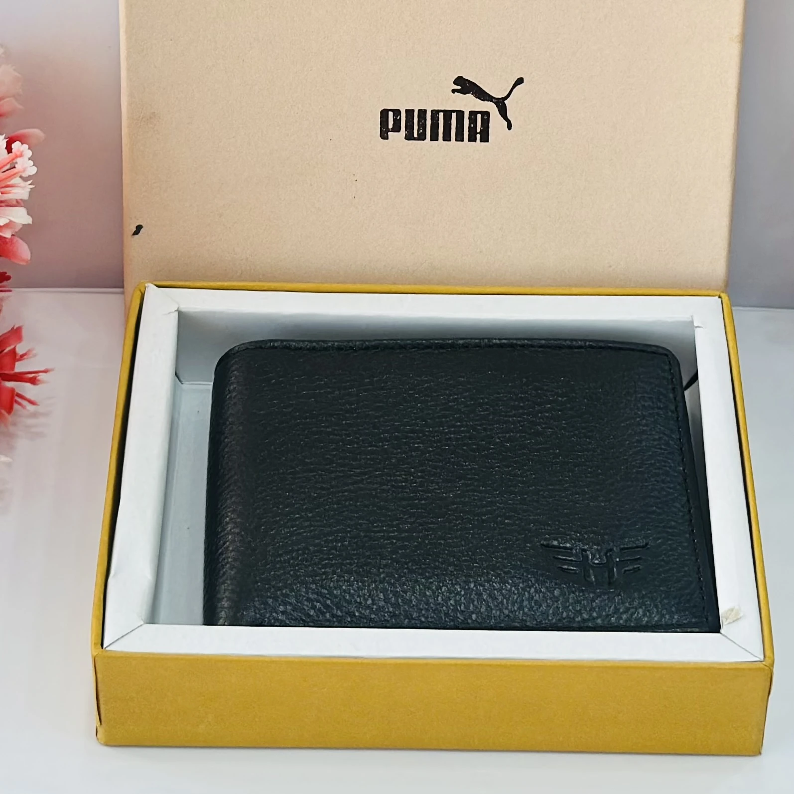 PUMA men's bi-fold leather wallet in black.