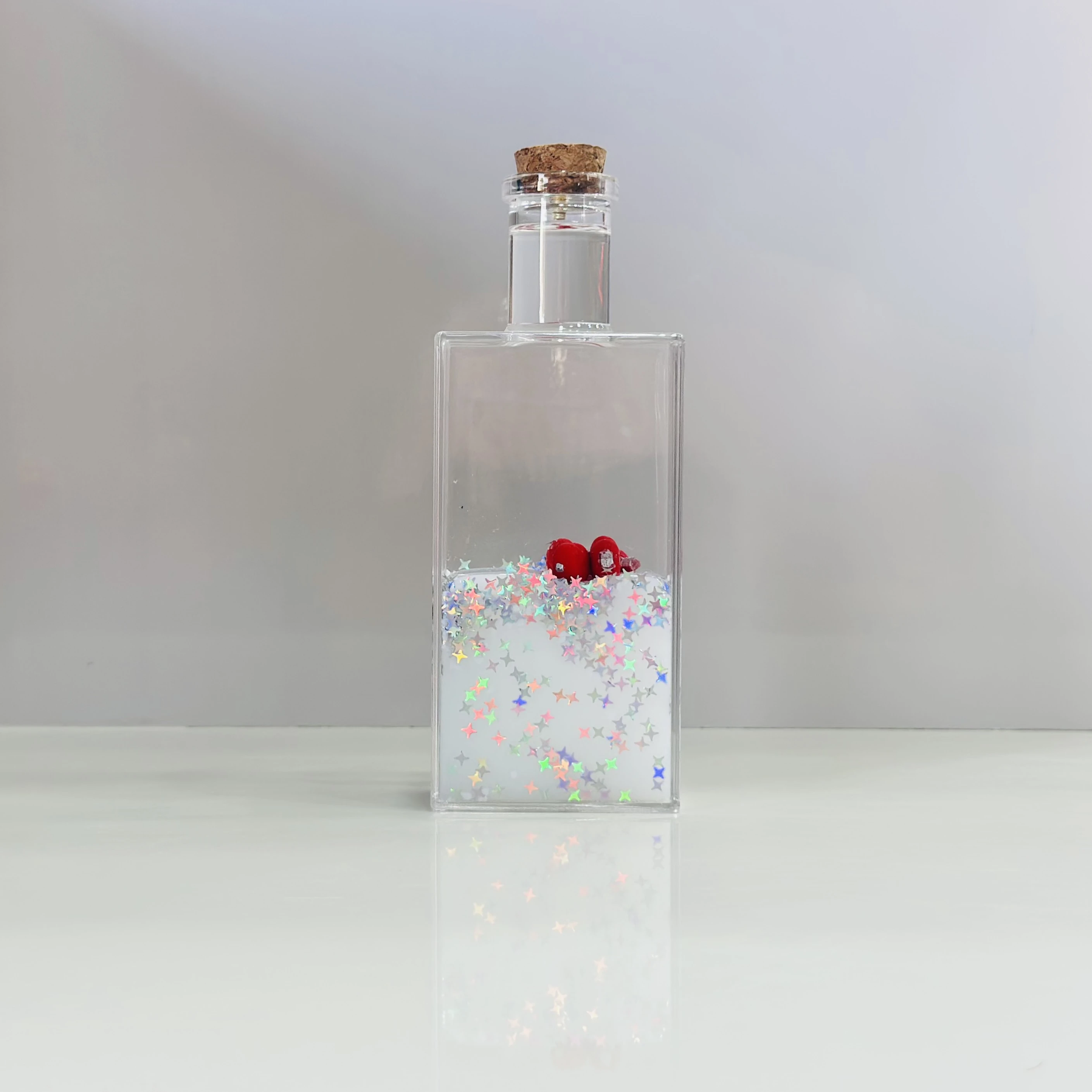 decorative fluid bottle with hearts and stars. (SKU-ATDL7R)