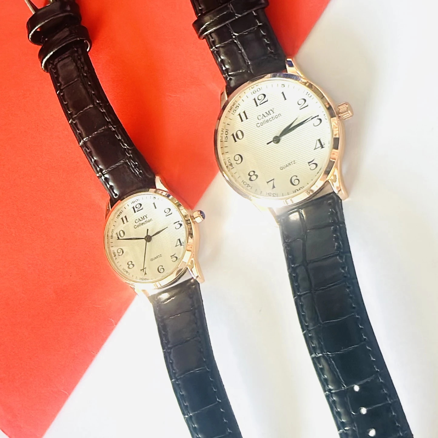 men's Camy Collection analog quartz watches with black leather straps and cream dials.