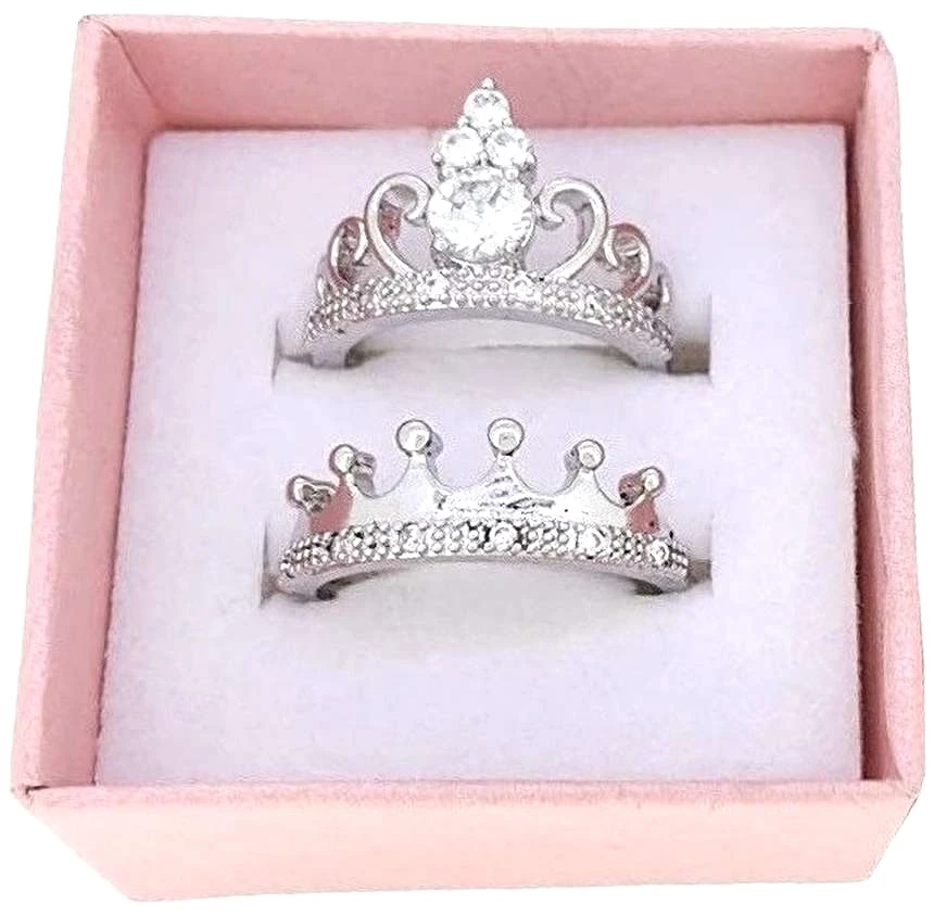 Set of silver-plated, cubic zirconia-studded, adjustable crown couple rings.